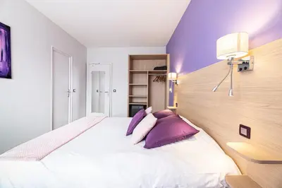 Un ou plusieurs lits dans un hébergement de l'établissement Hotel Helios - Golf