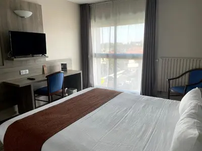 Un ou plusieurs lits dans un hébergement de l'établissement Grand Hotel