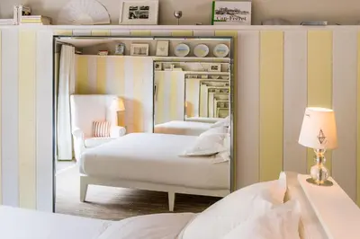 Un ou plusieurs lits dans un hébergement de l'établissement Hotel La Co(o)rniche