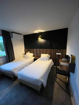 Un ou plusieurs lits dans un hébergement de l'établissement FastHôtel Mont de Marsan - Un Hôtel FH Collection