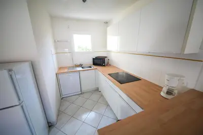Cuisine ou kitchenette dans l'établissement Résidence Indigo II - Ocean Plage Résidences