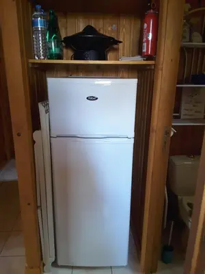 Cuisine ou kitchenette dans l'établissement Chalet Camping Les Vignes