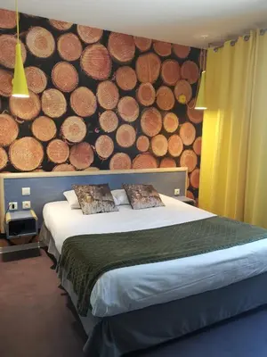 Un ou plusieurs lits dans un hébergement de l'établissement Au P'tit Creux des Landes