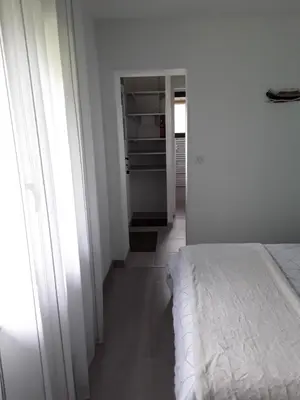 Un ou plusieurs lits dans un hébergement de l'établissement Chambre d'hôtes les Iris à Mios sur le Bassin d'Arcachon