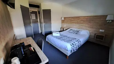 Un ou plusieurs lits dans un hébergement de l'établissement Abor Hôtel, Mont de Marsan