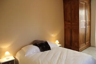 Un ou plusieurs lits dans un hébergement de l'établissement Les Chambres d'Eugénie
