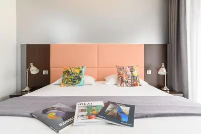 Un ou plusieurs lits dans un hébergement de l'établissement Hype Hôtel