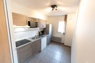 Cuisine ou kitchenette dans l'établissement Lagocéan