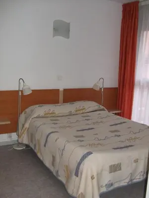 Un ou plusieurs lits dans un hébergement de l'établissement Les Pavillons du Rooy
