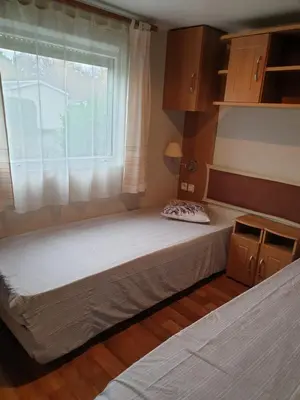 Un ou plusieurs lits dans un hébergement de l'établissement Pyla Chalet et mobilhom 6 personnes Magda