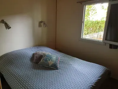 Un ou plusieurs lits dans un hébergement de l'établissement Pyla Chalet et mobilhom 6 personnes Magda