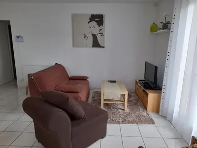 Coin salon dans l'établissement Maison familiale avec jardin, proche Dune du Pyla et parcs, idéale pour vacances ensoleillées - FR-1-319-362