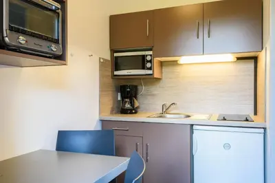 Cuisine ou kitchenette dans l'établissement Résidence Espace Thermal