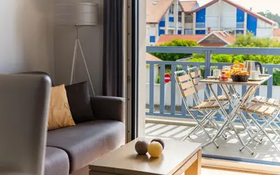 Coin salon dans l'établissement Lagrange Vacances Les Balcons de l'Océan