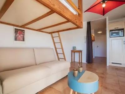 Coin salon dans l'établissement Apartment Le Grand Large by Interhome