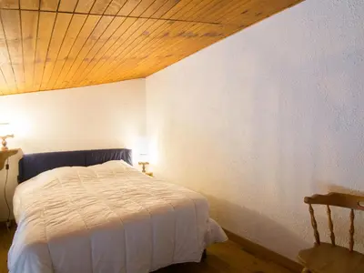 Un ou plusieurs lits dans un hébergement de l'établissement Apartment Douc-7 by Interhome
