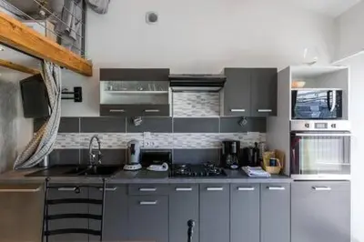 Cuisine ou kitchenette dans l'établissement PETIT COIN DE CHARME