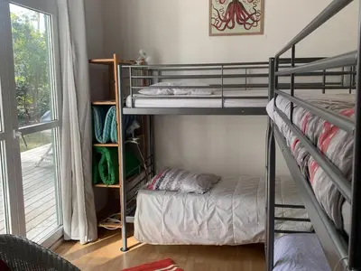 Un ou plusieurs lits dans un hébergement de l'établissement Villa 3 ch, proche lac et océan, au calme, animaux admis - FR-1-319-371