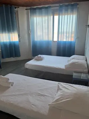 Un ou plusieurs lits dans un hébergement de l'établissement Hôtel Bellevue