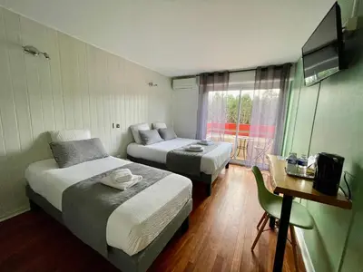 Un ou plusieurs lits dans un hébergement de l'établissement Hôtel Paris Madrid