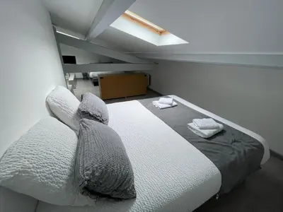 Un ou plusieurs lits dans un hébergement de l'établissement Hôtel Paris Madrid