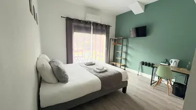 Un ou plusieurs lits dans un hébergement de l'établissement Hôtel Paris Madrid