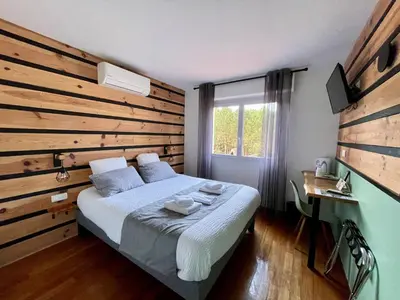 Un ou plusieurs lits dans un hébergement de l'établissement Hôtel Paris Madrid
