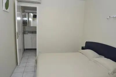 Un ou plusieurs lits dans un hébergement de l'établissement Hôtel Des Arceaux