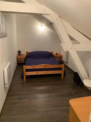 Un ou plusieurs lits dans un hébergement de l'établissement Maison spacieuse tout confort 10 personnes