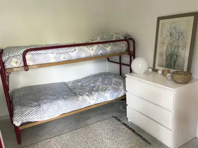 Un ou plusieurs lits dans un hébergement de l'établissement Appartement calme et familial au Centre d'Hossegor