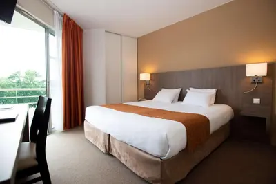 Un ou plusieurs lits dans un hébergement de l'établissement Best Western Hotel Sourcéo