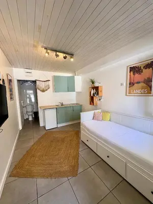 Un ou plusieurs lits dans un hébergement de l'établissement Studio entre lac et océan à Hossegor