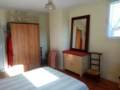 Un ou plusieurs lits dans un hébergement de l'établissement Ricouch, chambre d'hôtes et permaculture