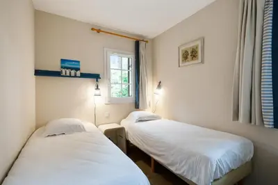Un ou plusieurs lits dans un hébergement de l'établissement Village Pierre & Vacances Moliets