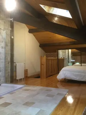Un ou plusieurs lits dans un hébergement de l'établissement gîte porte de la bastide