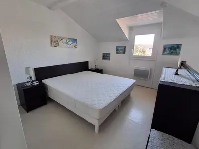 Un ou plusieurs lits dans un hébergement de l'établissement Villa patio à 200 m de la plage à Capbreton