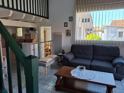 Coin salon dans l'établissement Villa patio à 200 m de la plage à Capbreton