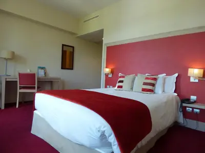 Un ou plusieurs lits dans un hébergement de l'établissement Hôtel du Parc