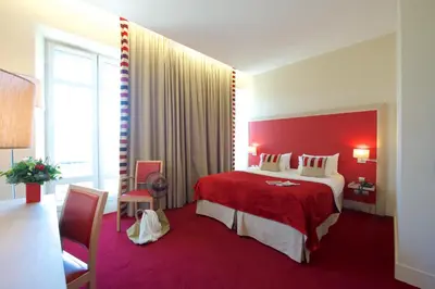 Un ou plusieurs lits dans un hébergement de l'établissement Hôtel du Parc