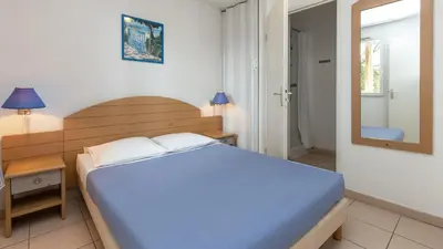 Un ou plusieurs lits dans un hébergement de l'établissement Vacancéole - L'Allée des Dunes - Ondres Plage