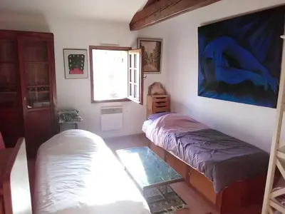 Un ou plusieurs lits dans un hébergement de l'établissement Maison rustique près de Callen avec piscine