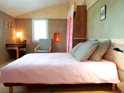 Un ou plusieurs lits dans un hébergement de l'établissement Maison cosy avec piscine privée à Estibeaux 38 m²