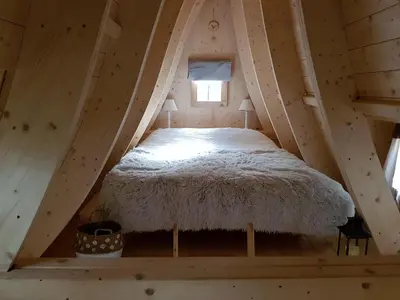 Un ou plusieurs lits dans un hébergement de l'établissement Cabane Spa 40