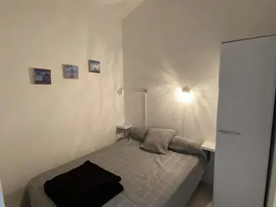 Un ou plusieurs lits dans un hébergement de l'établissement Appartement avec terrasse, parking et vue sur port à Capbreton - FR-1-413-130