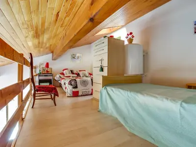 Un ou plusieurs lits dans un hébergement de l'établissement Maison T2 avec Mezzanine à Biscarrosse Plage, Terrasse et Barbecue - FR-1-521-82