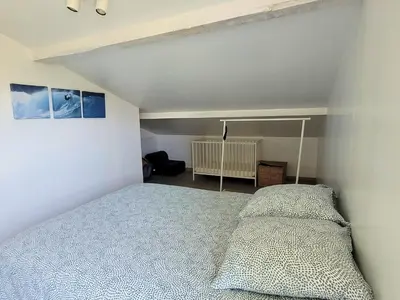 Un ou plusieurs lits dans un hébergement de l'établissement DUNES - Villa Patio Avec Jardin - proche Plage de la Gravière