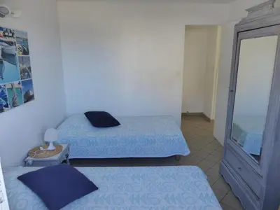 Un ou plusieurs lits dans un hébergement de l'établissement Appartement Pour 4 Personnes Dans Villa Dans Le Vent