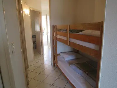 Un ou plusieurs lits dans un hébergement de l'établissement Appartement récent proche de la plage