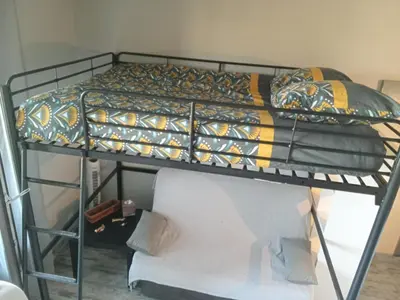 Un ou plusieurs lits dans un hébergement de l'établissement LE SPOT Studio'Hotel 