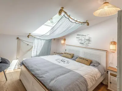 Un ou plusieurs lits dans un hébergement de l'établissement Apartment Domaine Aïga-1 by Interhome